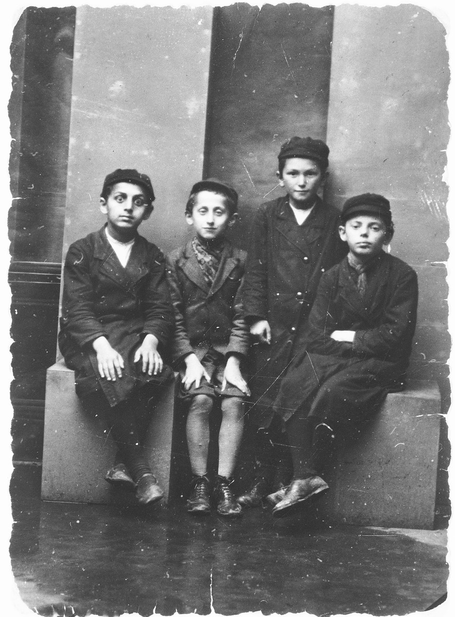 Studio portrait of four Orthodox Jewish boys.  

[One of the boys is probably Yehiel Milchberg.]