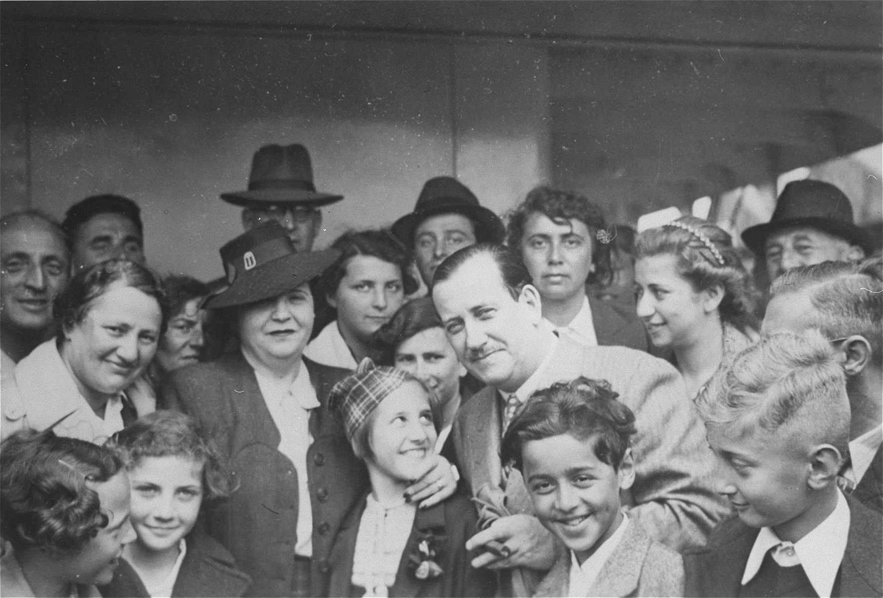 Mr. and Mrs. Morris Troper meet with passengers on board the refugee ship MS St. Louis.  

Also pictured are Liesel Joseph, Ruth Karliner, Heinz Gallant and Windmueller.