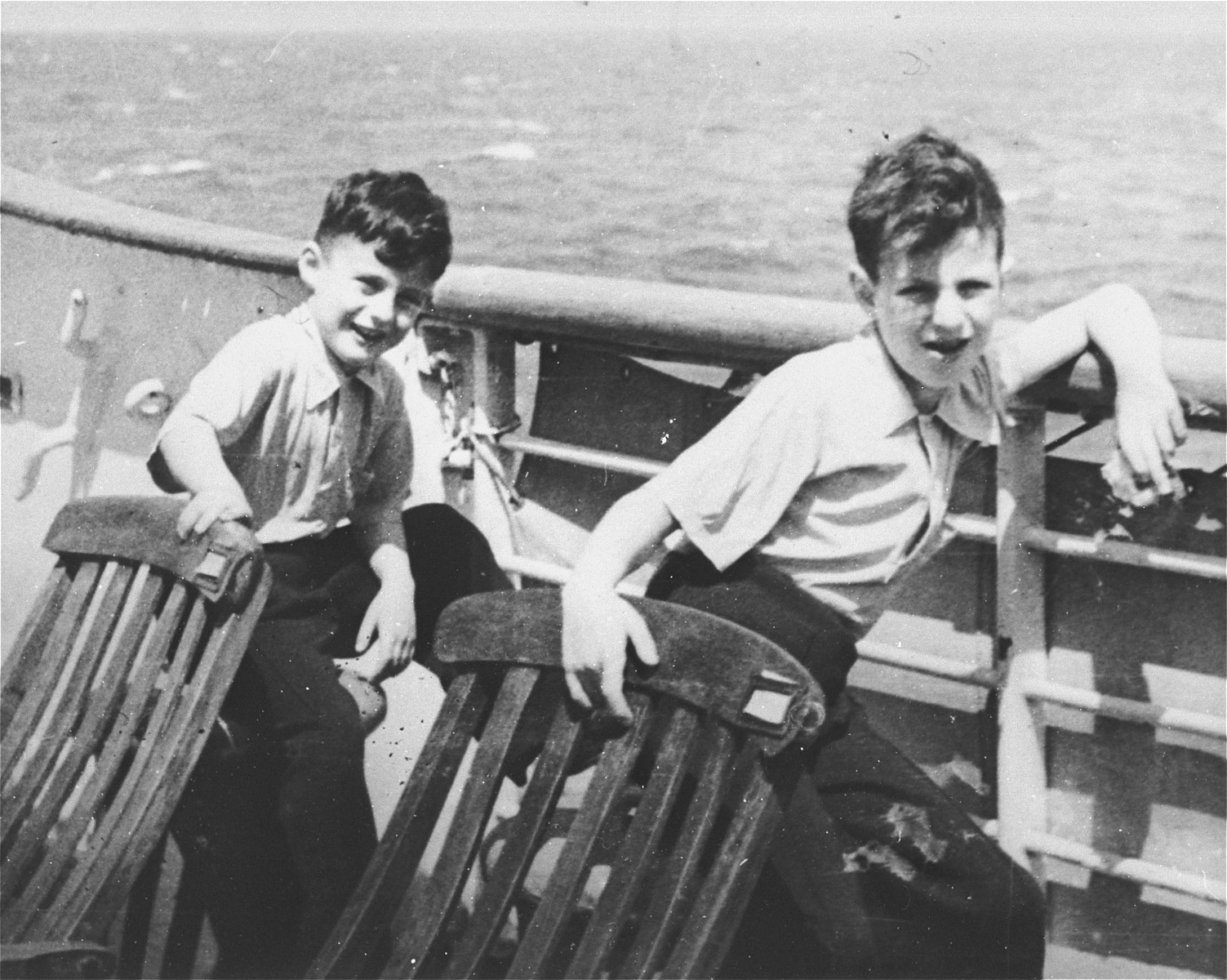 Gerd and Rolf Altschul brothers sit by the railing on board the St. Louis.  

Photo from the personal St. Louis photo album assembled by Lotte Altschul.
