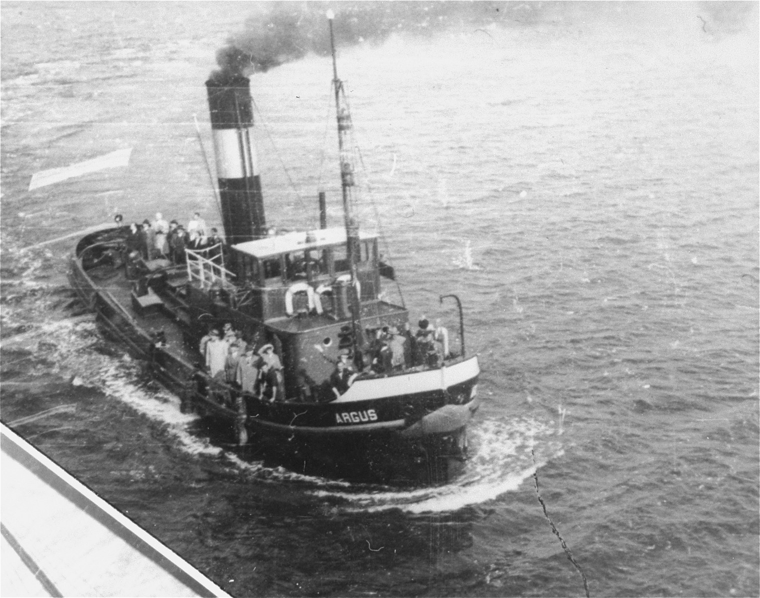 A small boat carrying Morris Troper from the JDC approaches the MS St. Louis in advance of its landing in Antwerp.

Photo from the personal St. Louis photo album assembled by Lotte Altschul.