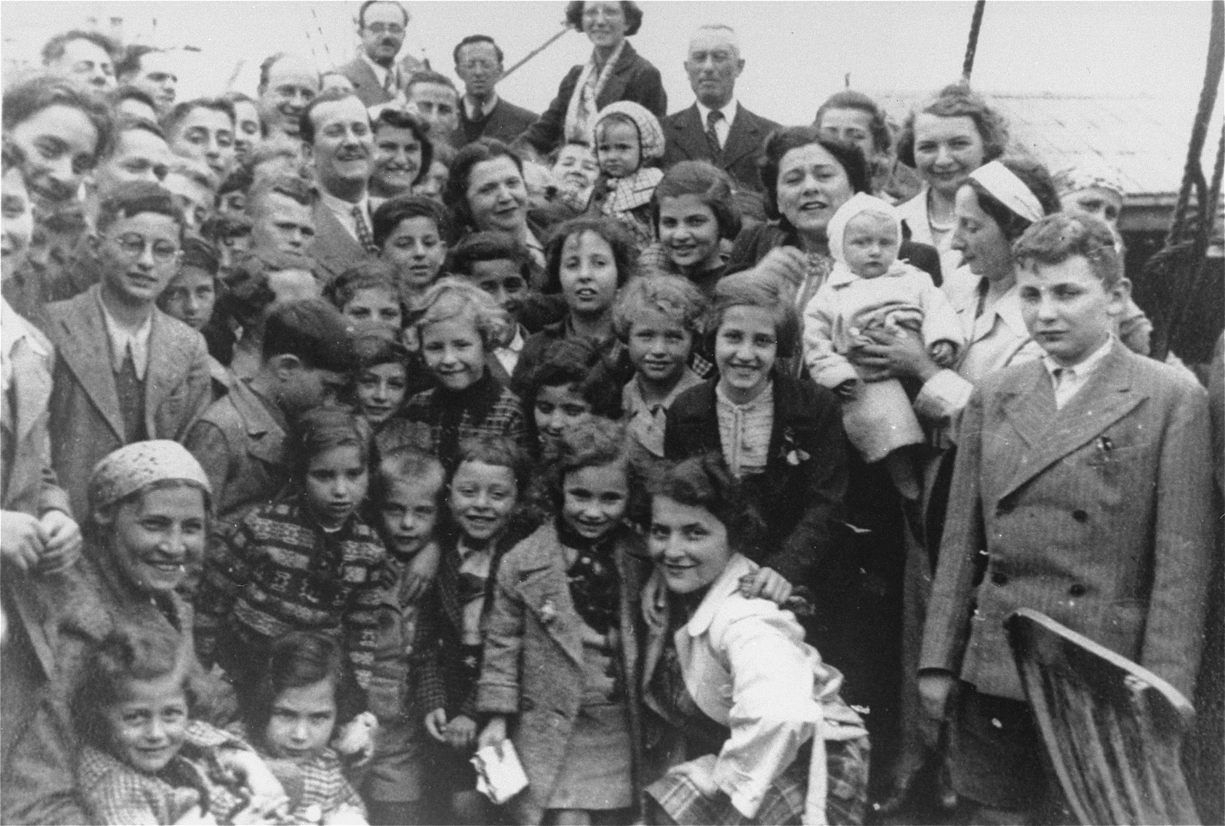 Passengers aboard the MS St. Louis.

Liane Reif, is standing at center, foreground.  Her brother Fred is standing first from the right.  Among the other passengers are Liesl Loeb, Herbert Karliner, Troper, Hans Fischer, Lisl Mandel, Henry Gallan, Judl Gunther and Oskar Blechner.