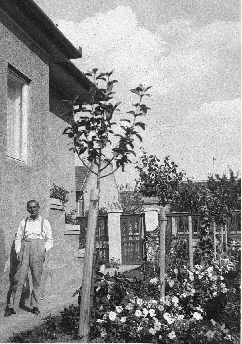 Jeno Pick, the grandfather of Gyorgy Pick, poses beside his home located at Dorozsmai Street 26, Budapest XIV.
