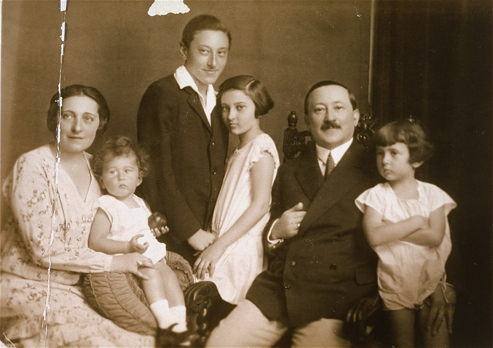 Portrait of the family of Pal Kornhauser in Budapest.  

Pictured from left to right are: Aranka (Shatz) Kornhauser, Janos Kornhauser (the child on her lap), Endre Kornhauser, Lilly Kornhauser, Pal Kornhauser and Tamas Kornhauser.
