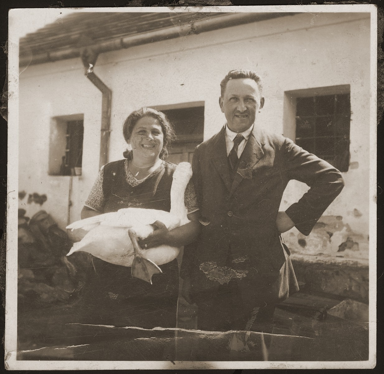 Otto and Klara Spaeth pose with a goose in the backyard of their home in Buchlovice.