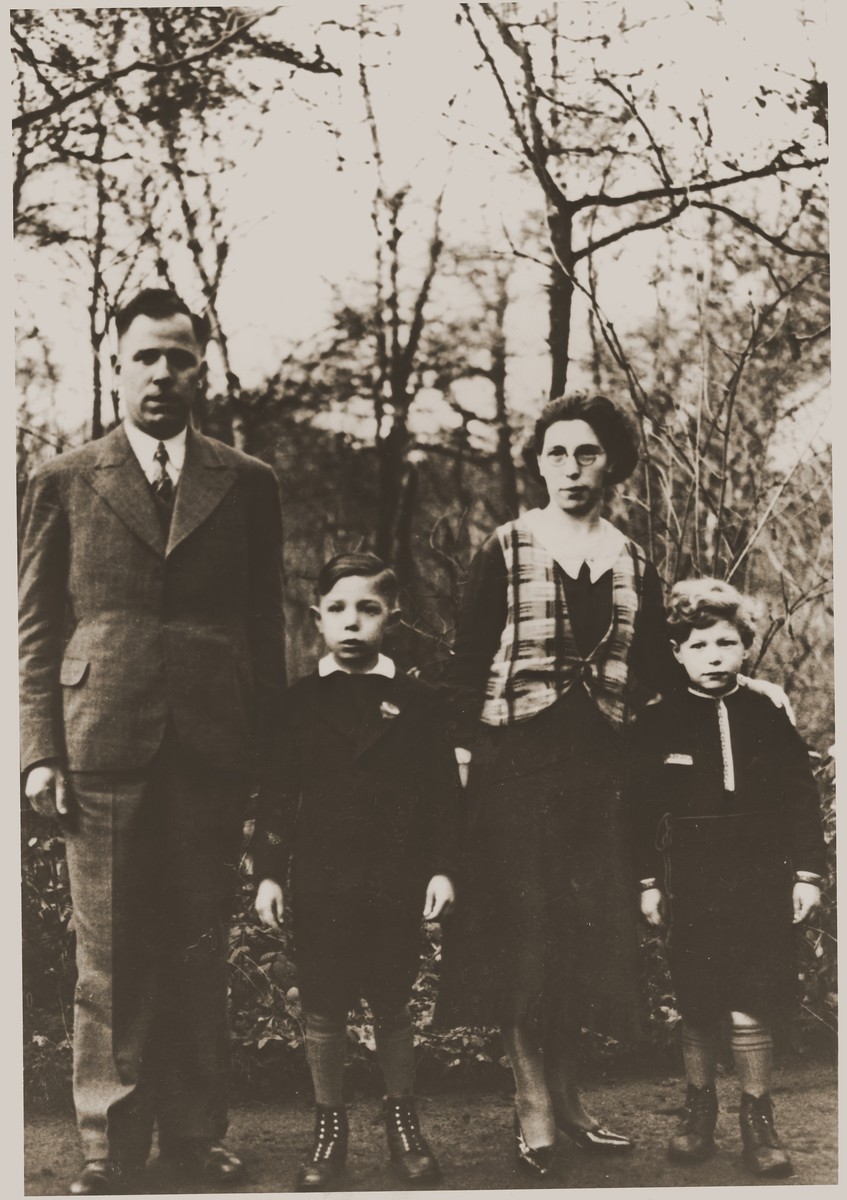 Portrait of the Bluschtein family.  

Pictured from left to right are Abram, Julien, Adele and Arnold Bluschtein.