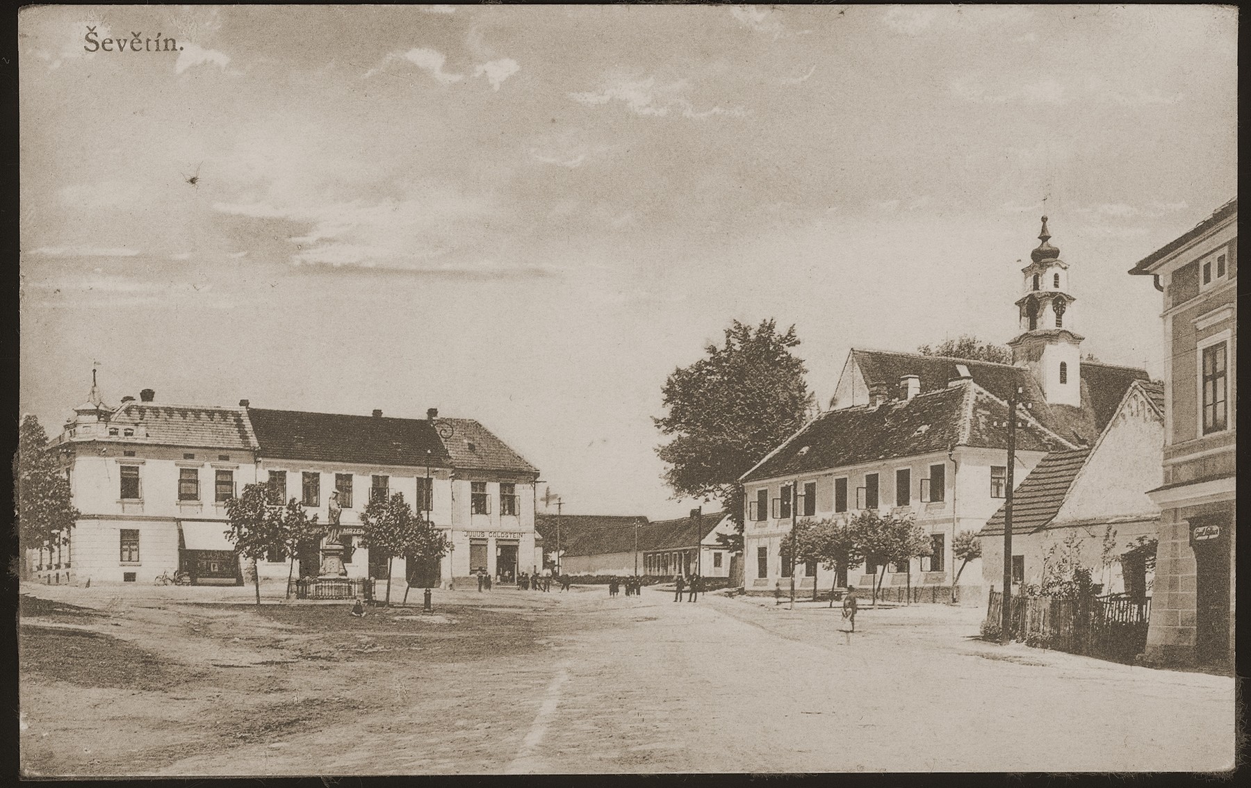 Picture postcard of the market square in Sevetin, Czechoslovakia.  

Julius Goldstein's general store is visible at the center left.