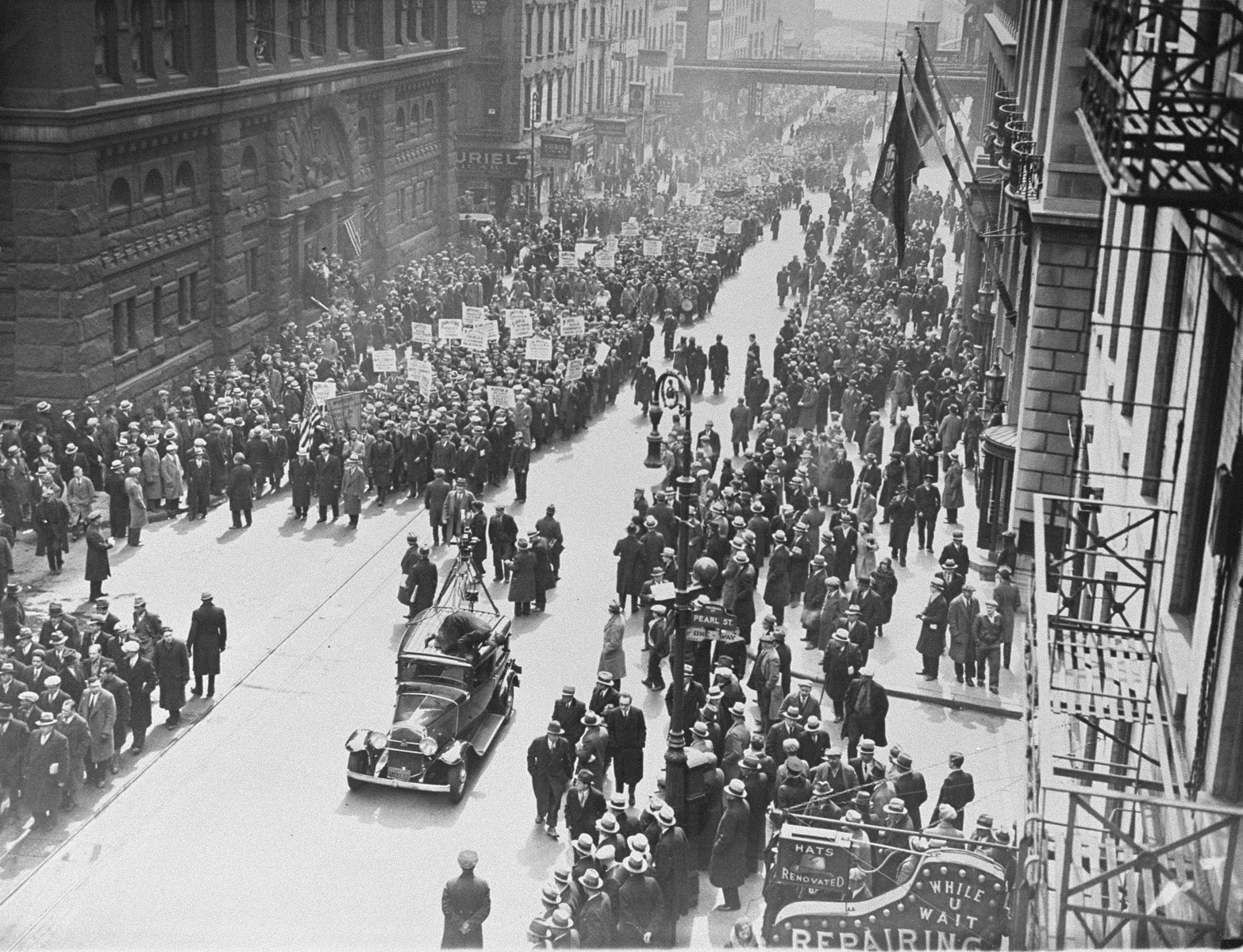 Members of the American communist party participate in a march through the streets of lower Manhattan to protest against the Nazi persecution of German Jews.