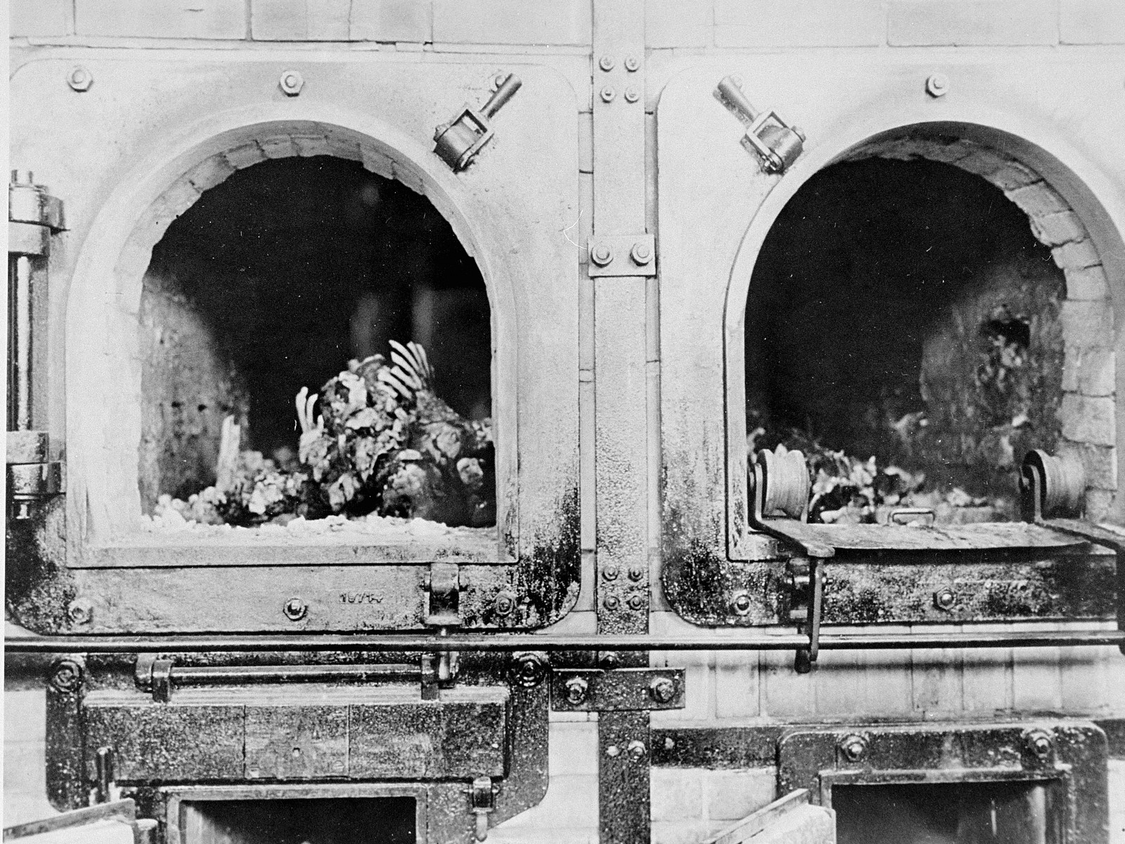 The charred remains of former prisoners in two crematoria ovens in the newly liberated Buchenwald concentration camp.

Original caption reads:  "These charred remains of former prisoners were found in the crematory of the Buchenwald concentration camp just outside Weimar when U.S. forces entered the area"