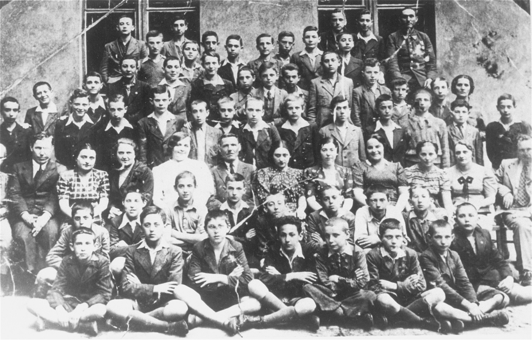 Group portrait of students in Class VII during their final semester at the Jewish public school no.121 (known as Konstadt) in Lodz.  

Among those pictured is Solly Perel (second row from the front, second from the left).