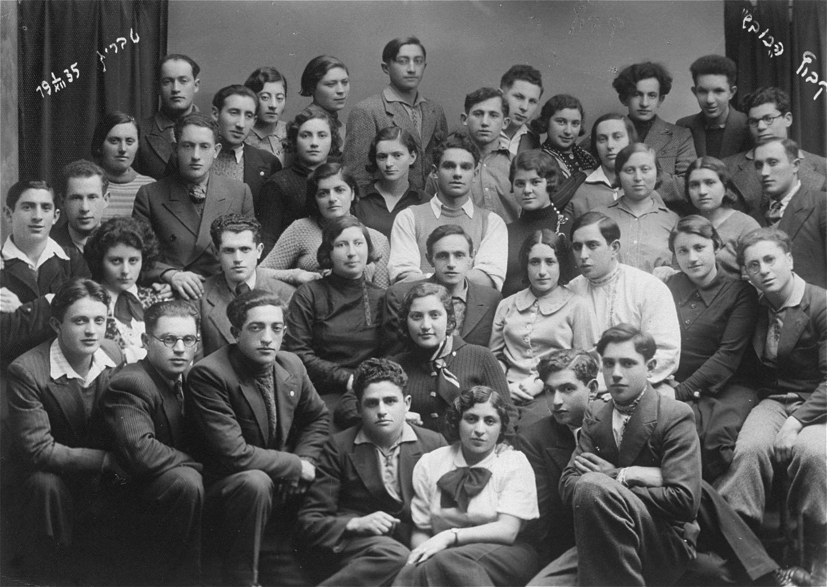 Group portrait of members of the kibbutz hachshara, Hakovesh in Taurage. 

Among those pictured is Eliezer Kaplan, third from the left.