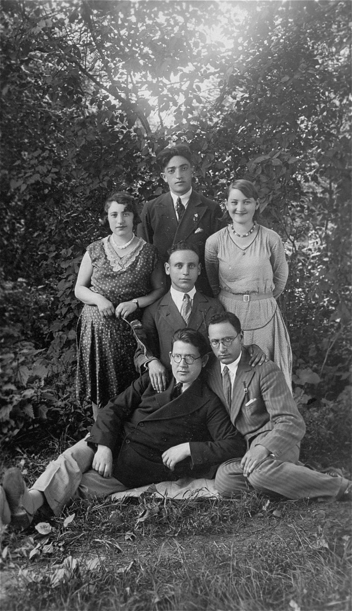 Group portrait of young Jewish men and women in Lithuania. 

Pictured at the top is the donor's father, Eliezer Kaplan.