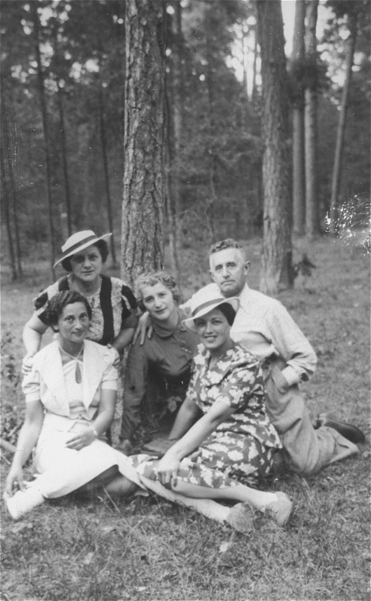 Members of the Bobrow family and friends rest during an outdoor excursion..