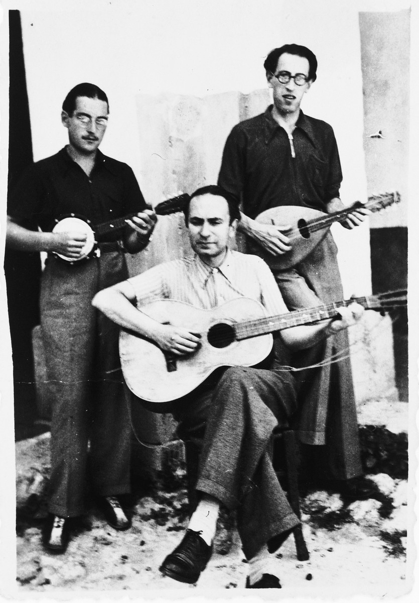 Three internees play stringed instruments in the Campagna internment camp. Walter Wolff is standing on the left.