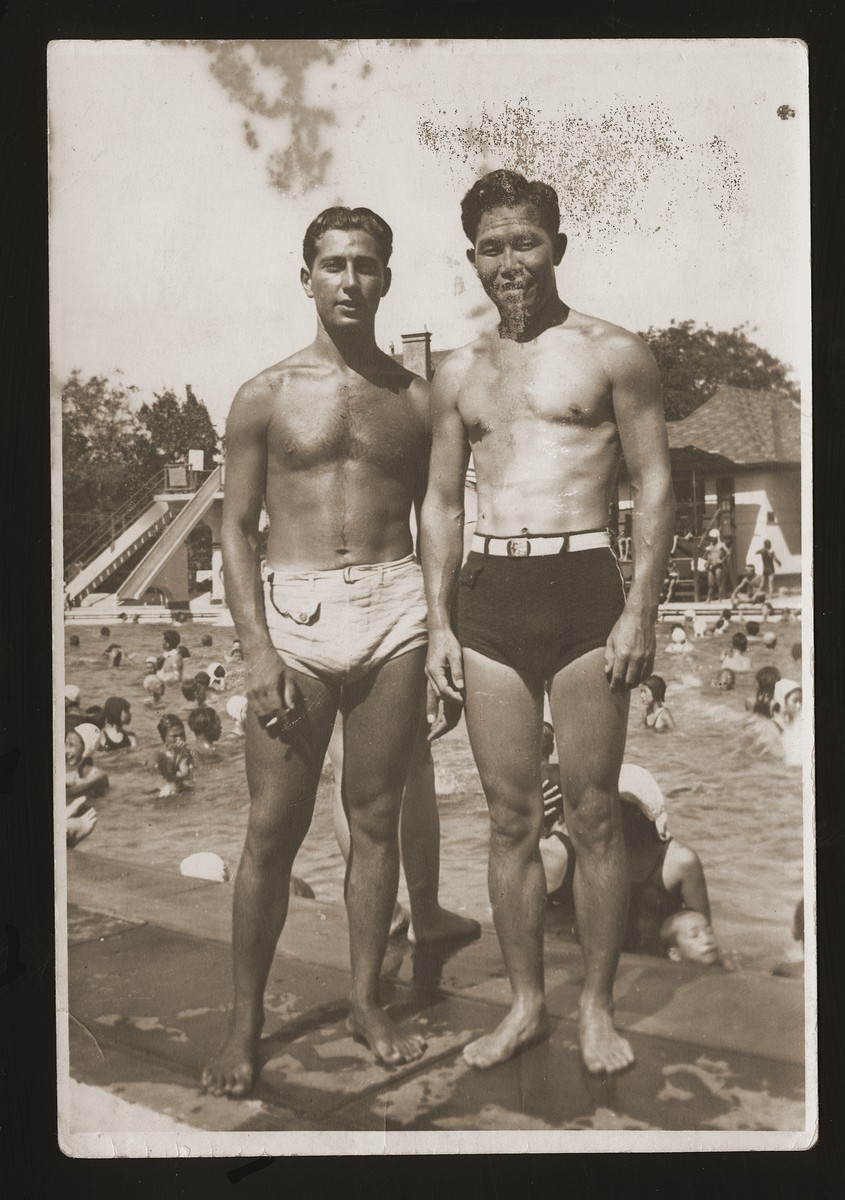 Peter Victor, a Jewish refugee from Berlin, with Mr. S. Mitzu at the Hongkew Park swimming pool in Shanghai where he found employment as a life-guard.