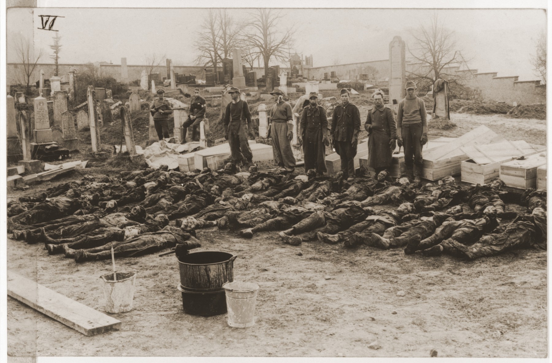 German POW's are forced by Soviet guards to rebury corpses exhumed from a mass grave in Czechoslovakia.