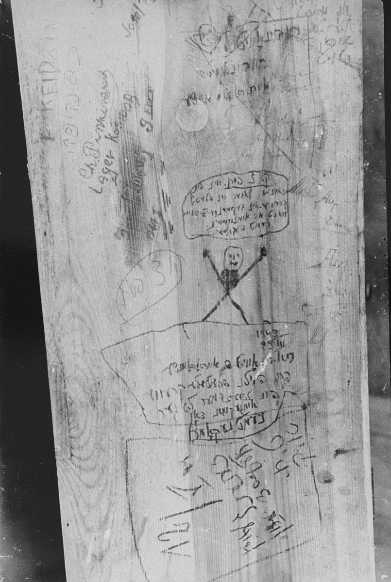 Messages scrawled by Jewish prisoners on a wall inside Fort IX, shortly before their execution.

George Kadish photographed the writings on the walls of the prison after liberation.  One of the messages reads: "On July 4th, 84 men were brought from Vilna; 60 were killed right away (shot) and burned, 82 were shot later."