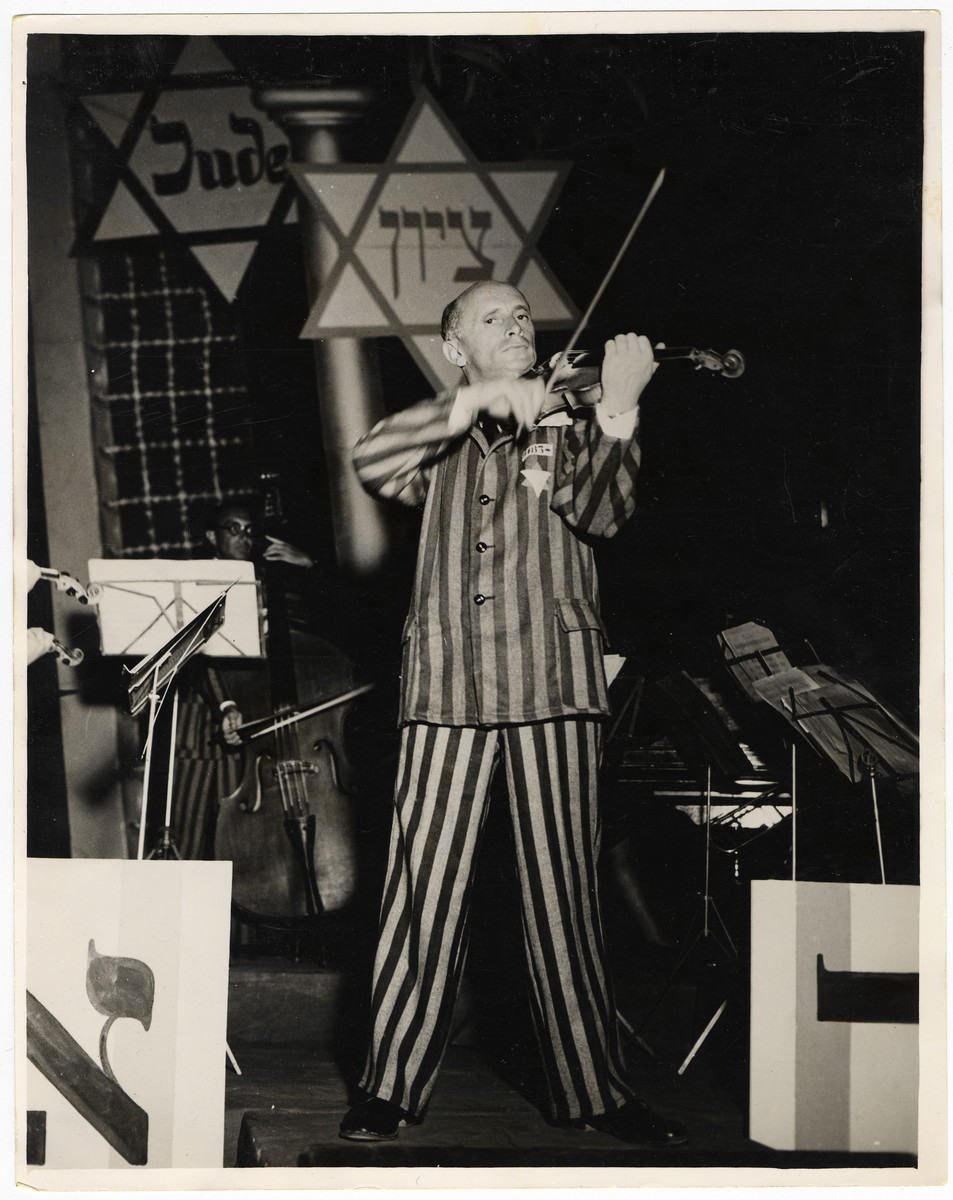 Michael Hofmekler the conductor of the Saint Ottilien Ex-Concentration Camp Orchestra performs a concert in Munich for American soldiers and UJA staff.