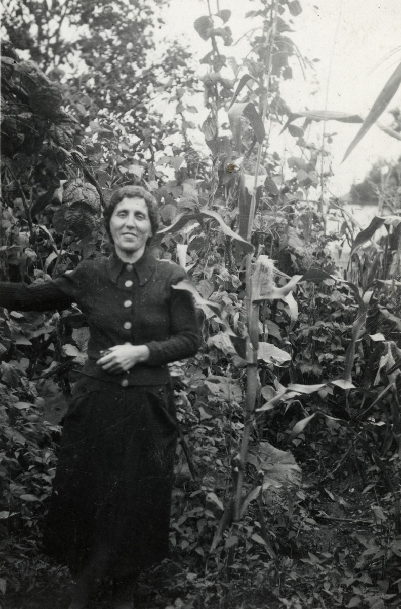 Yocheved Schaechter (mother of the donor) stands in the yard of her home in Tacovo.