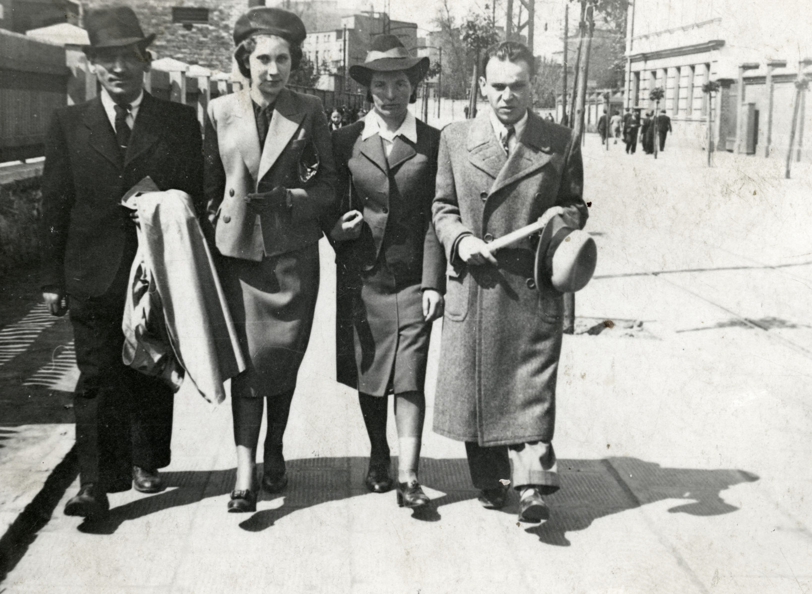 Jonas and Rywka Markowicz walk down a street in Sosnowiec shortly before the start of World War II.

Jonas and Rywka Markowicz are on the left.