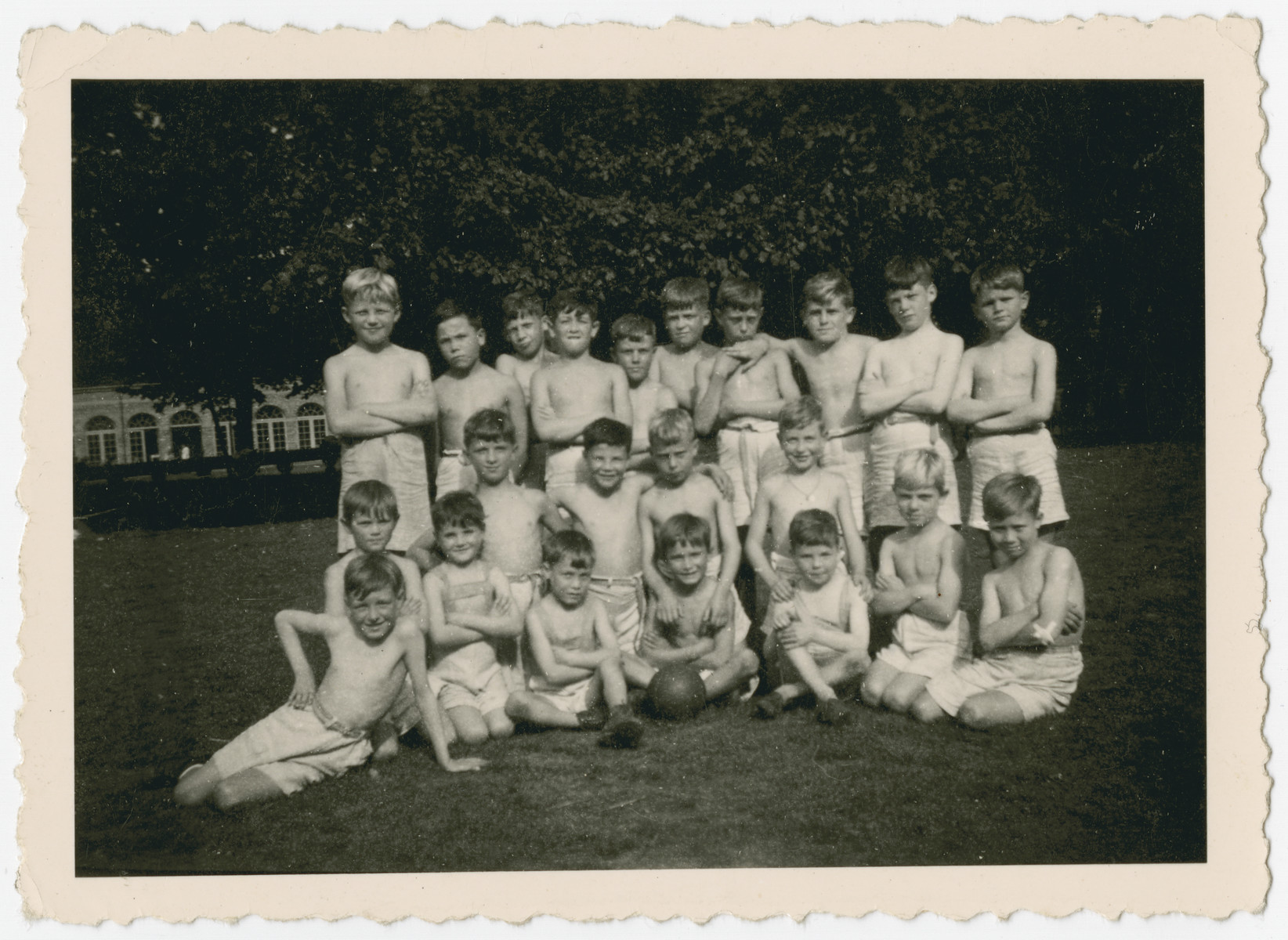 Elementary school boys, many of them Jewish children in hiding, pose on the grounds of the Chateau de Beloeil.