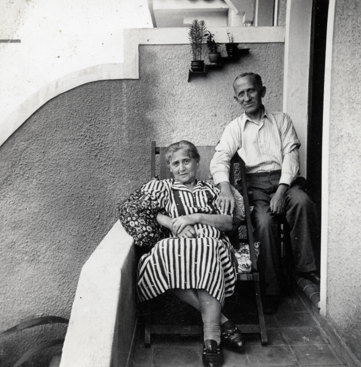 Zvi's maternal grandparents, Mr. and Mrs. Izaak Weissbrod, pose on their porch after immigrating to Brazil.