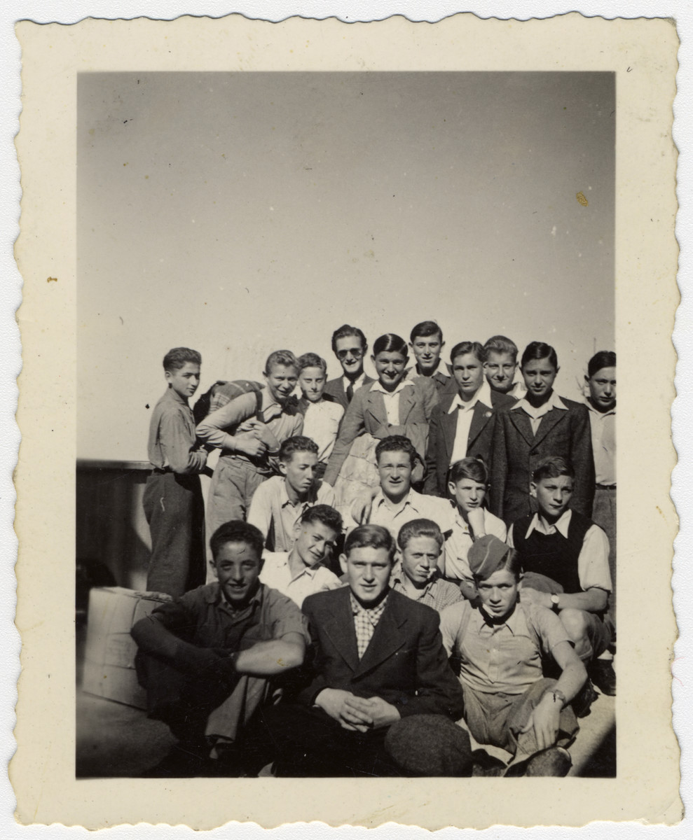 Group portrait of "Buchenwald Boys", teenage survivors of Buchenwald, in a children's home in Switzerland.

Henry Kolber is pictured in the second row on the far right.  Murray (Monek) Goldfinger is pictured in the first row, on the far left.