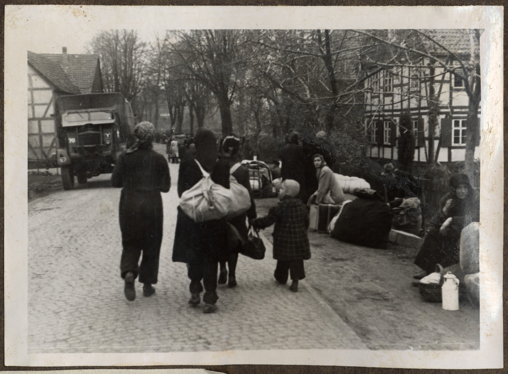 Thousands of Germans enter and leave from the British to the Russian Zone of Occupation on the road to the Friedland Refugee Camp.
