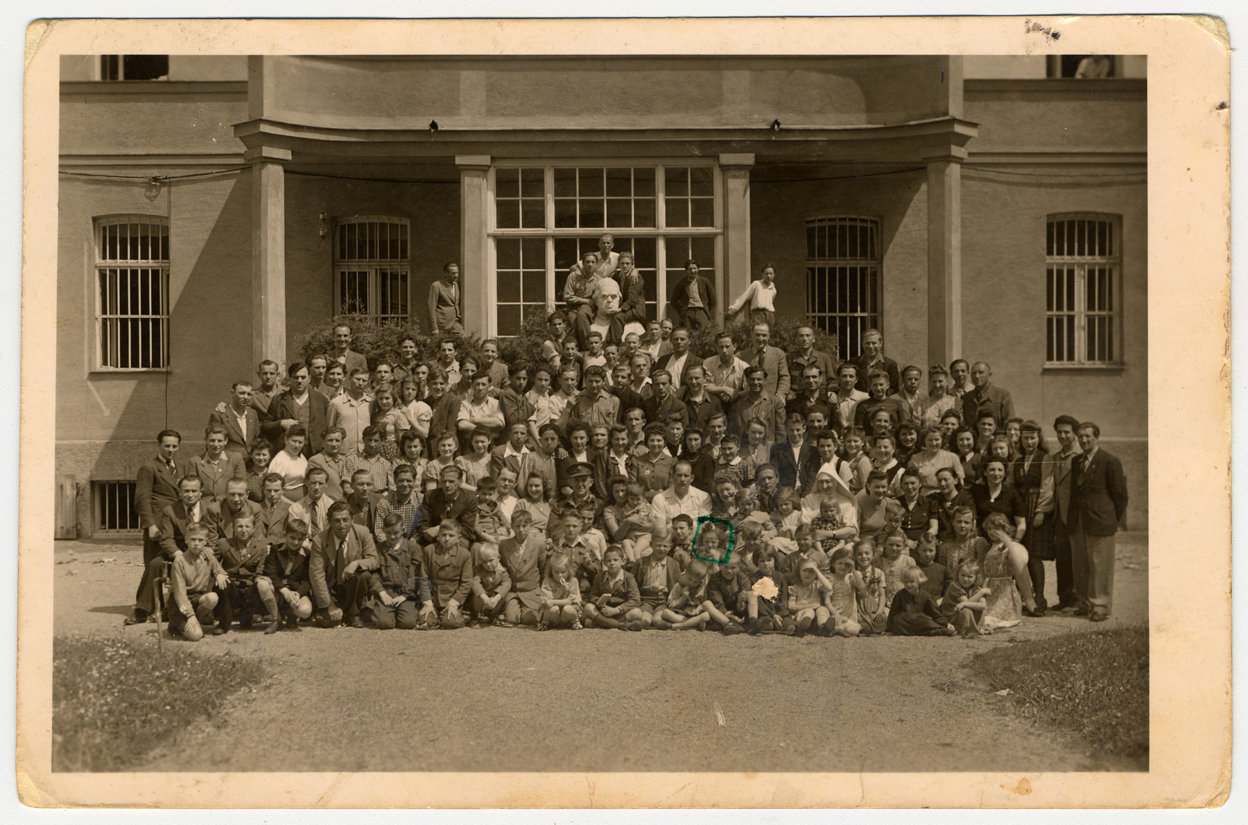Group portrait of displaced persons at  Bad Woerishofen.

Among those pictured is Lucia Fenster (second row, circled).  Pictured in the first row standing third from the right is Rucha Halina Parys, who was born in Radomsko, Poland.