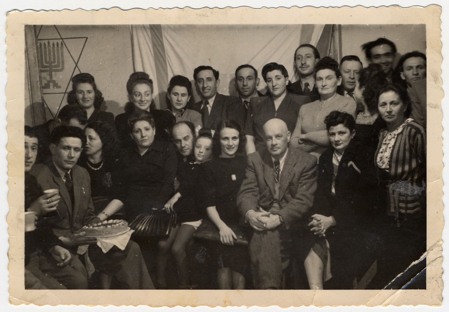Group photograph of displaced persons in the Foehrenwald Displaced Persons Camp.

Among those pictured are Fancia Silberschein Hellman (back row, far left), Regina Gertner (back row, second from the left), Samuel Gertner (back row, fifth from the left), and Lucy Gertner (front row, child fifth from the left).