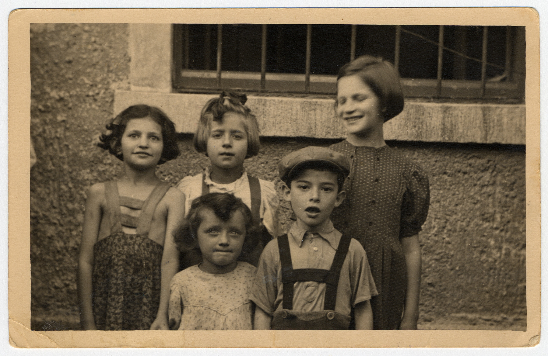 A group of children in the Salzburg Displaced Persons Camp.

Among those pictured are Lusia Fenster (later Lucy Gertner), front row left; Channah Kaplan (later Charlotte Borofsky) on the far left; and Shainka Kaplan (later Janet Wenitsky) on the far right.