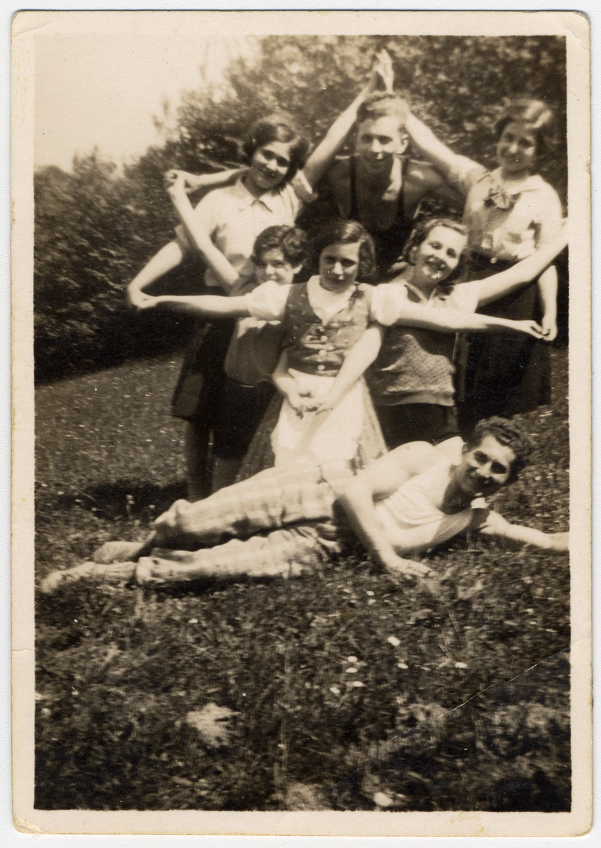 Zionist youth in a Shomer Hatzair camp pose in the formation of a Jewish Star.

Andor Willer reclines on the ground underneath.