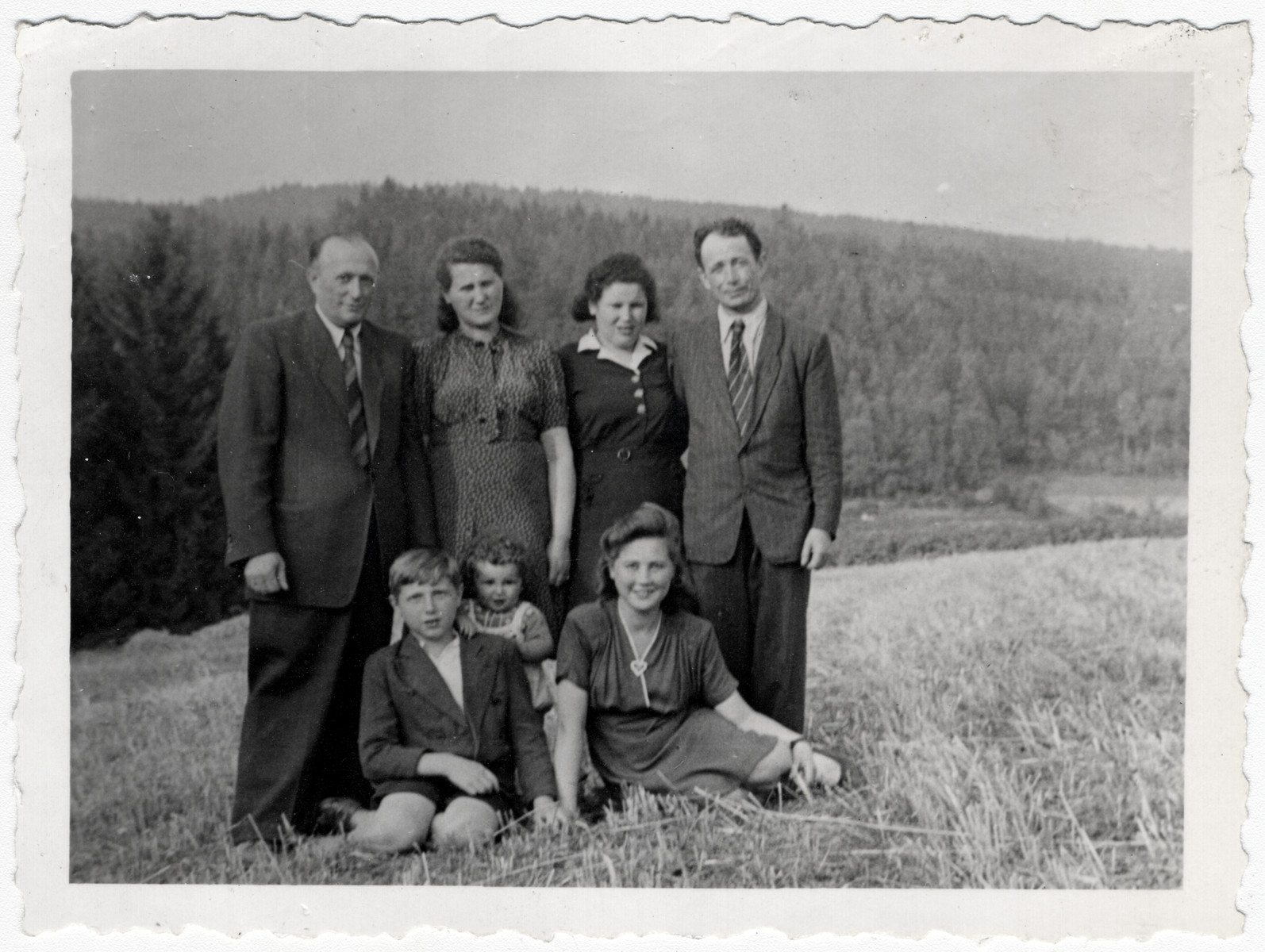 The Malach family poses with their friends and cousins, the Reichmans in Amberg.

Front row: Abraham Malach, Abraham Reichman and Bela Malach.  Standing: Mordka and Chana Malach and Gitl and Mordechai Reichman.