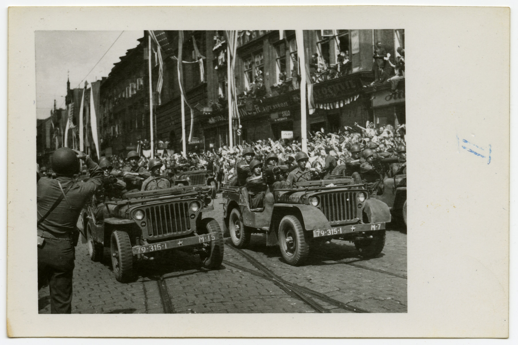 American soldiers drive through Pilsen, Czechoslovakia on its liberation day.