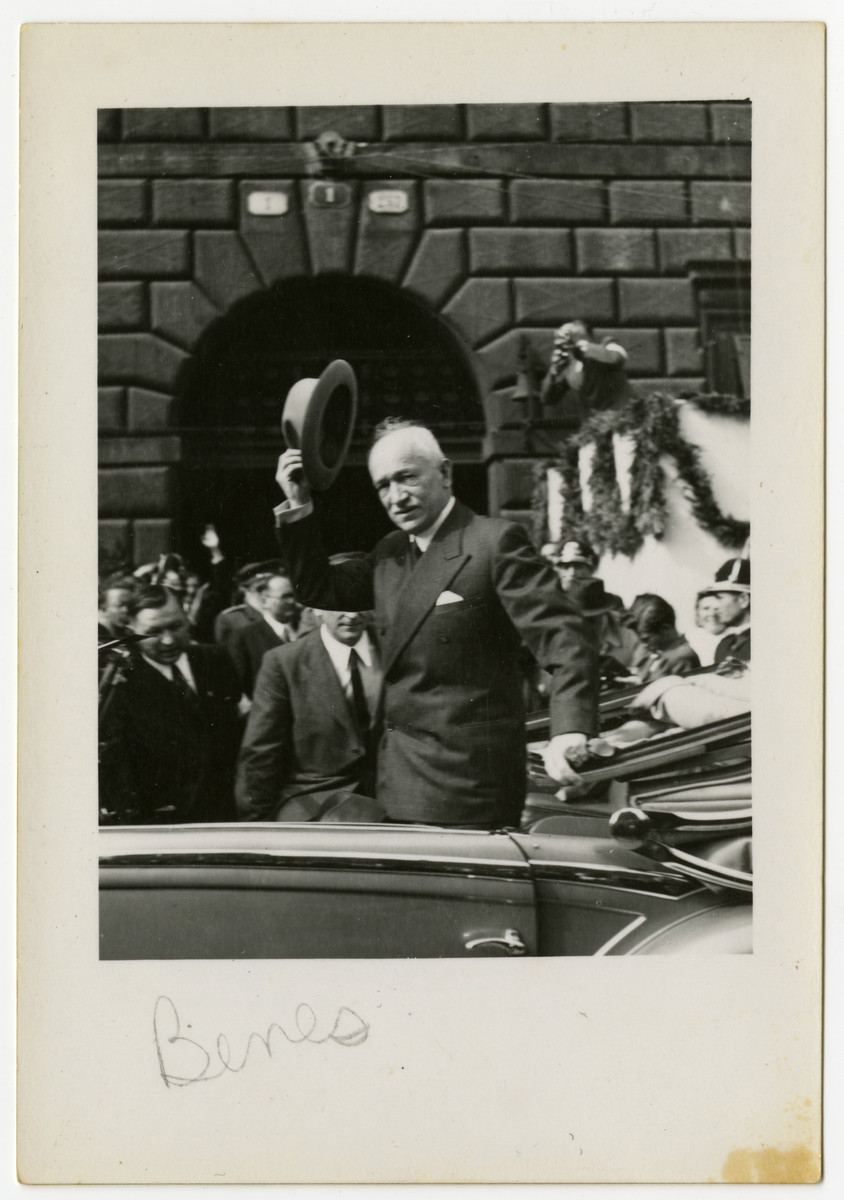 President Edvard Benes of Czechoslovakia doffs his hat as he drives through a street in Pilsen.