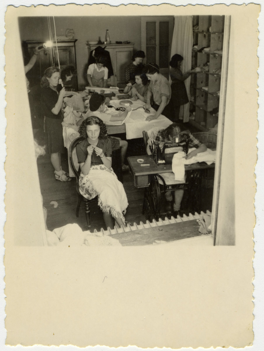 Girls learn to sew in the Versoix children's home.

Pictured in front is Fella Horowitz (Tamar Ben-Porat).