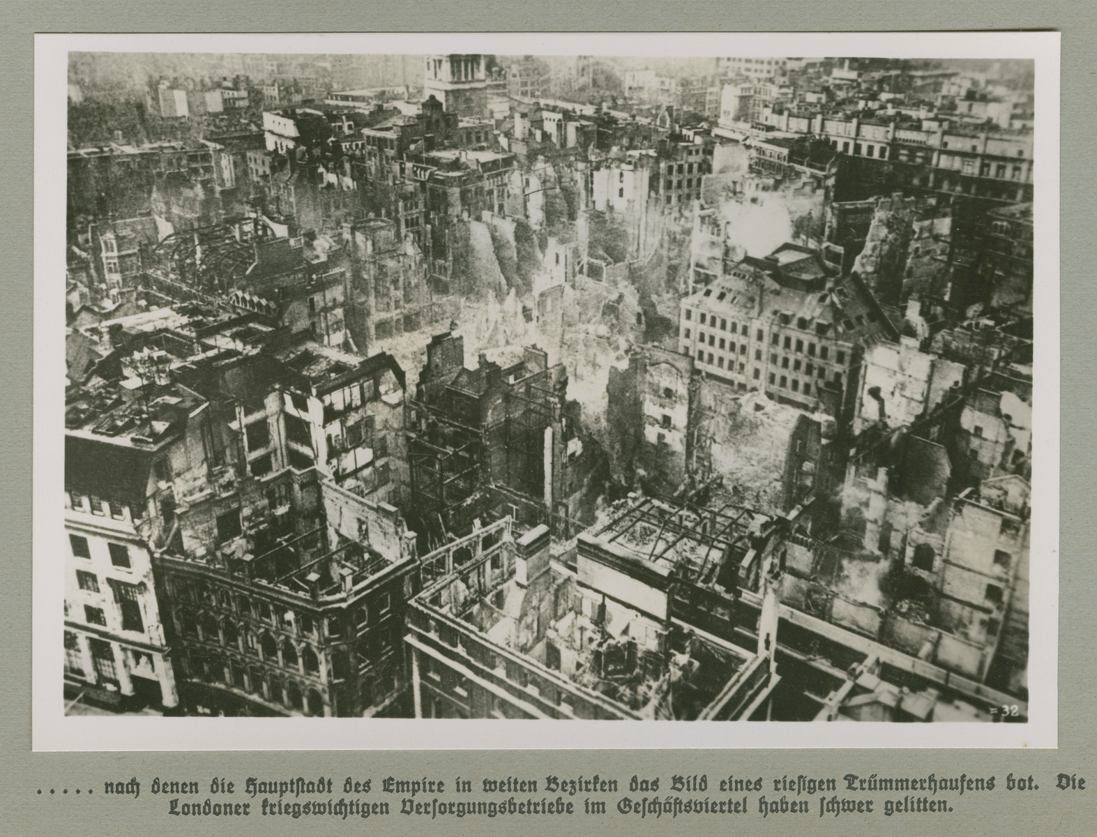 Aerial view of a bombed city quarter in London.

Original caption reads: ...after the capital of the empire was made into a giant pile of rubble in those districts pictured. London's strategic utilities companies in the commercial district suffered heavily.