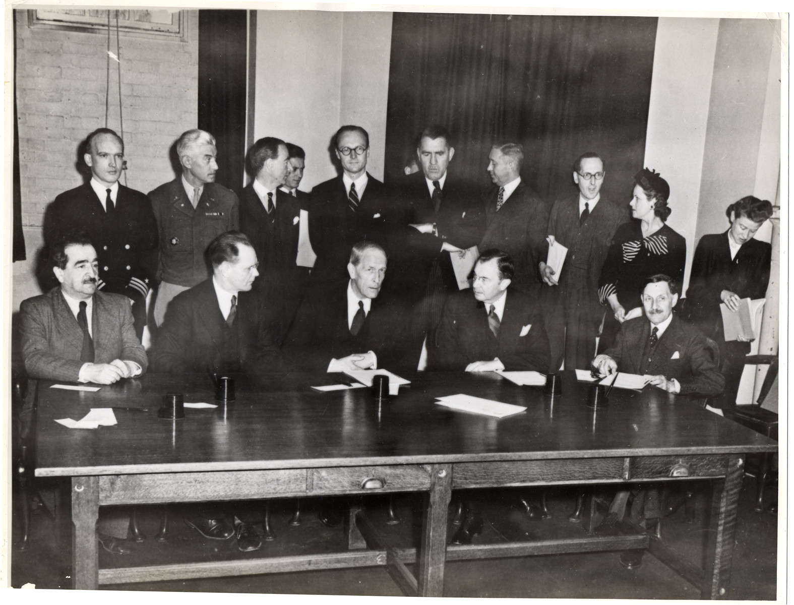 The members of the War Crimes Executive Committee at the signing of the agreement to create the International Military Tribunal to prosecute German war criminals.  

Among those pictured are Major General I.T. Nikitchenko (second from the left) who will represent the U.S.S.R. on the Tribunal, Justice Robert Jackson (second from the right) who will be the chief U.S. prosecutor, and Robert Falco (right), who will be the alternate French member of the Tribunal.