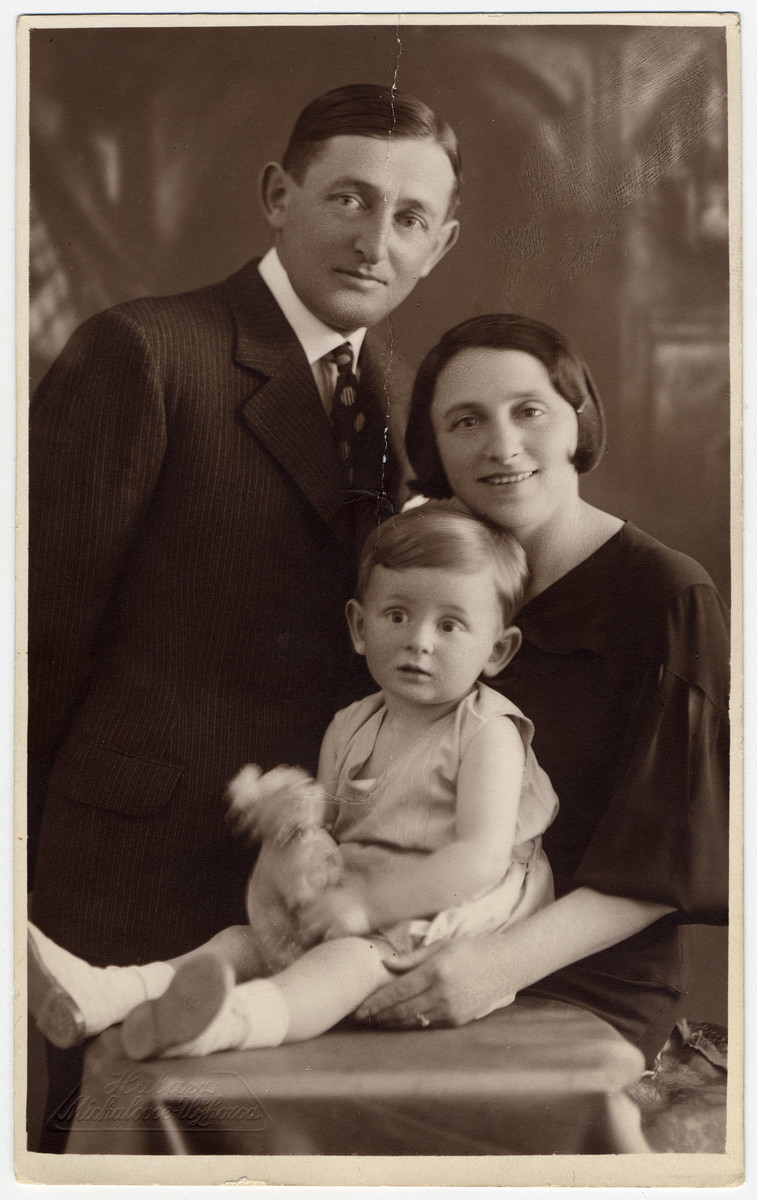 Studio portrait of Richard Brand with his parents, Moshe and Etel.