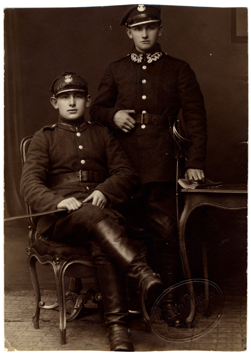 Portrait of Harry Posmantier's Uncle Samuel wearing their Polish Army uniforms.   

Samuel's wife and three children perished at Auschwitz.