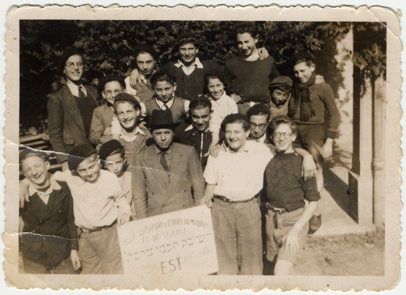 Group portrait of students in the Yeshiva Chochmei Tzorfat (scholars of France) in Aix-les-Bains.

Rabbi Chaikin is pictured in the center.  To his immediate right is Jacques (Jacko) Klein.