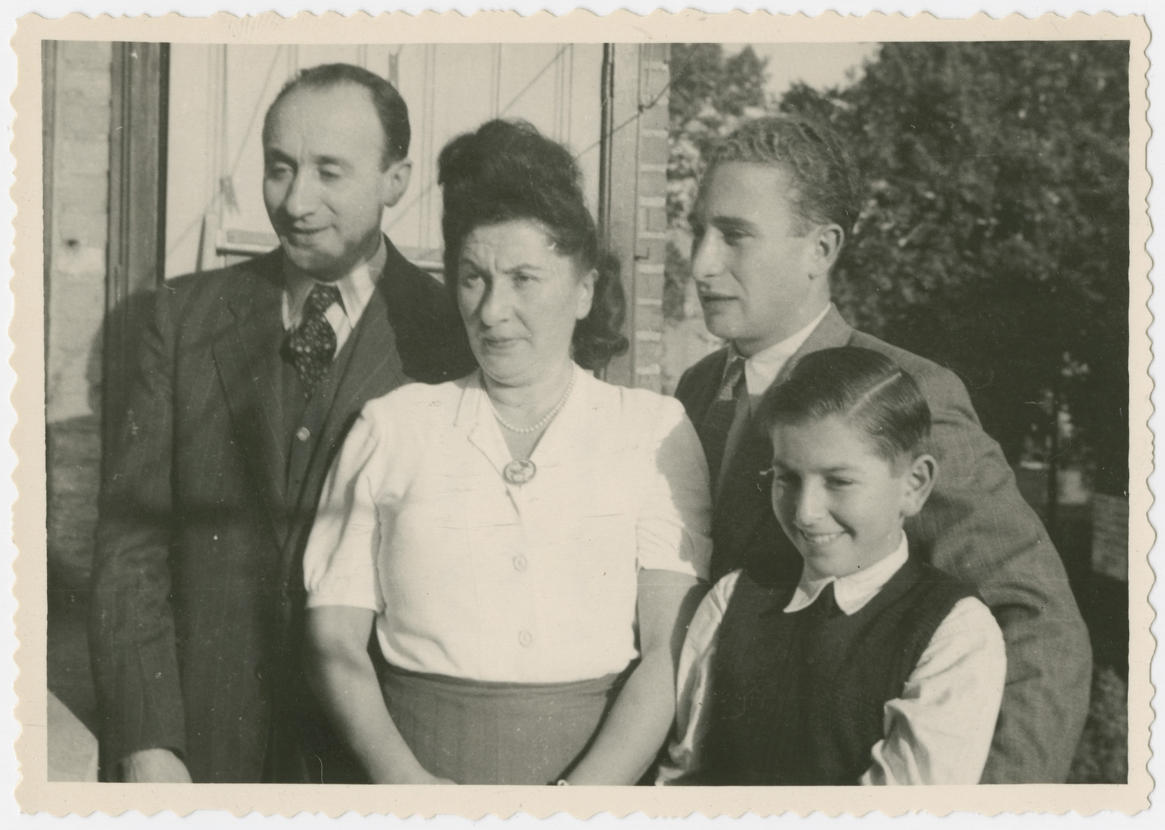 Portrait of the Elbaum/Nusbaum family in their home in Brussels.

From left to right are Chiel Elbaum (the donor's step-father), Regina Nusbaum Elbaum (the donor's mother), Chaim Elbaum (the donor's step-brother) and Mark Nusbaum.