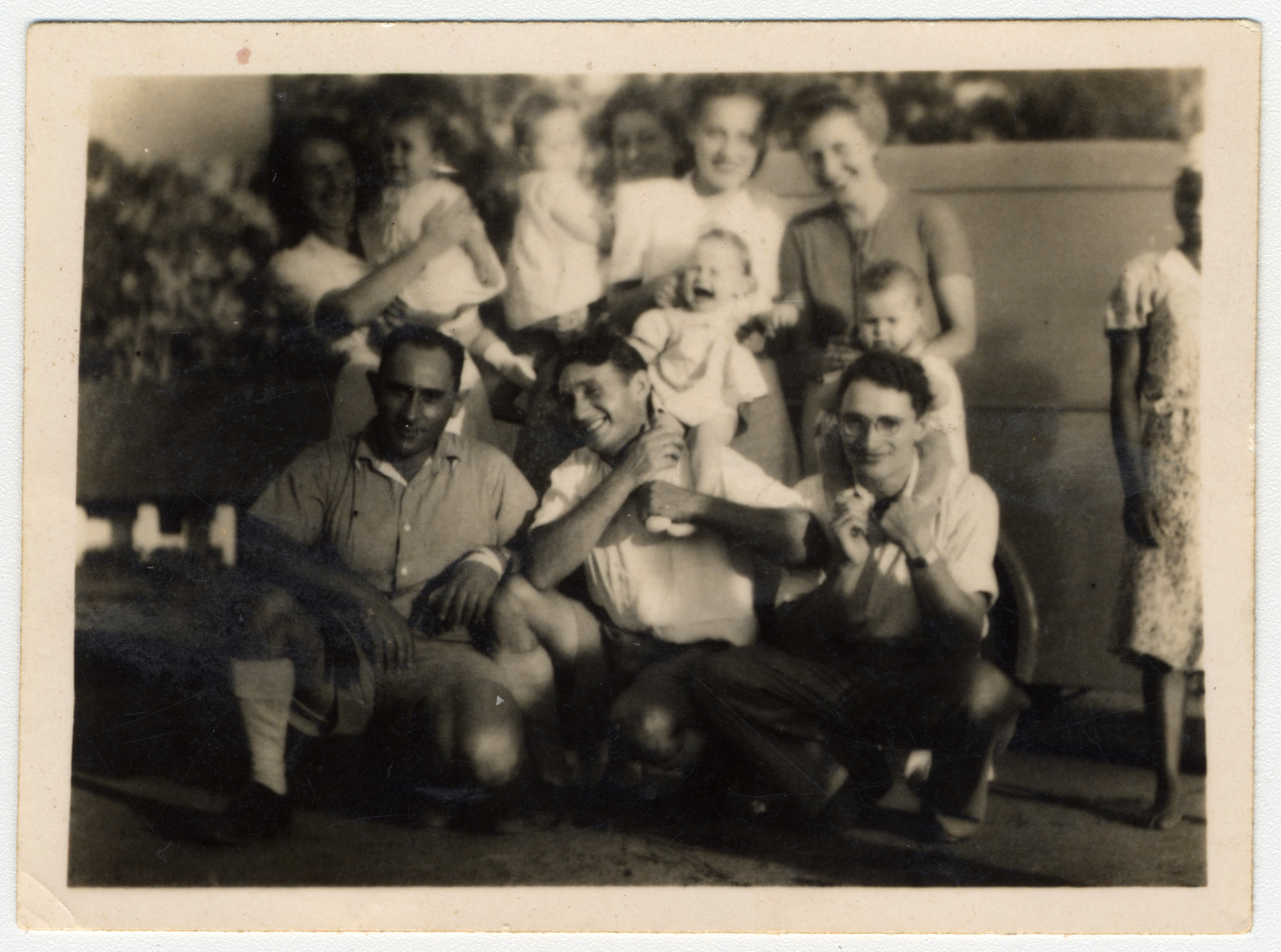 Group portrait of parents and infants in Nyasaland.

Lily Haber is in the top row on the right and Kalman Haber is in the bottom row in the middle.