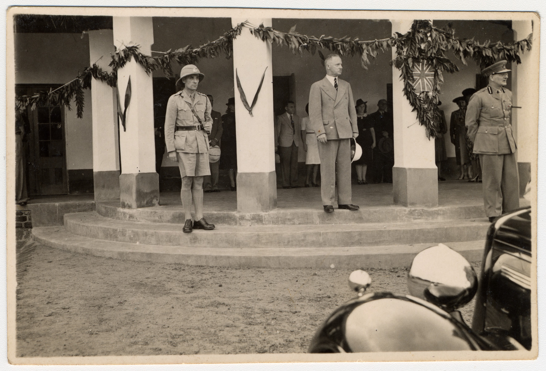 British officials pay a formal visit to the internment camp in Nyasaland for enemy aliens.

Standing in the back between the two columns are Kalman and Lily Haber.