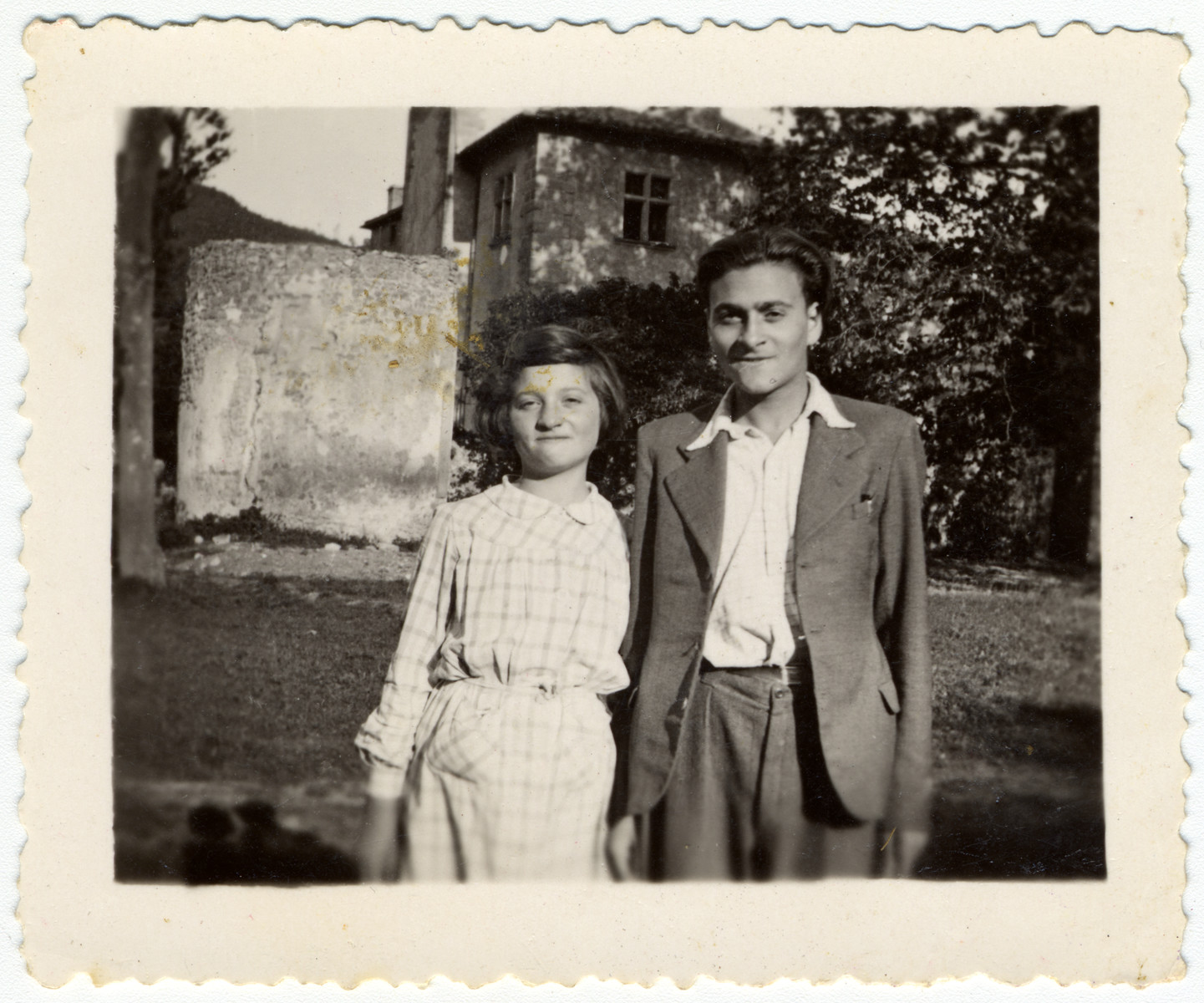 Two siblings stand in front of the children's home of Chateau de la Hille.

Pictured are Martha and Heinz Storosum.
