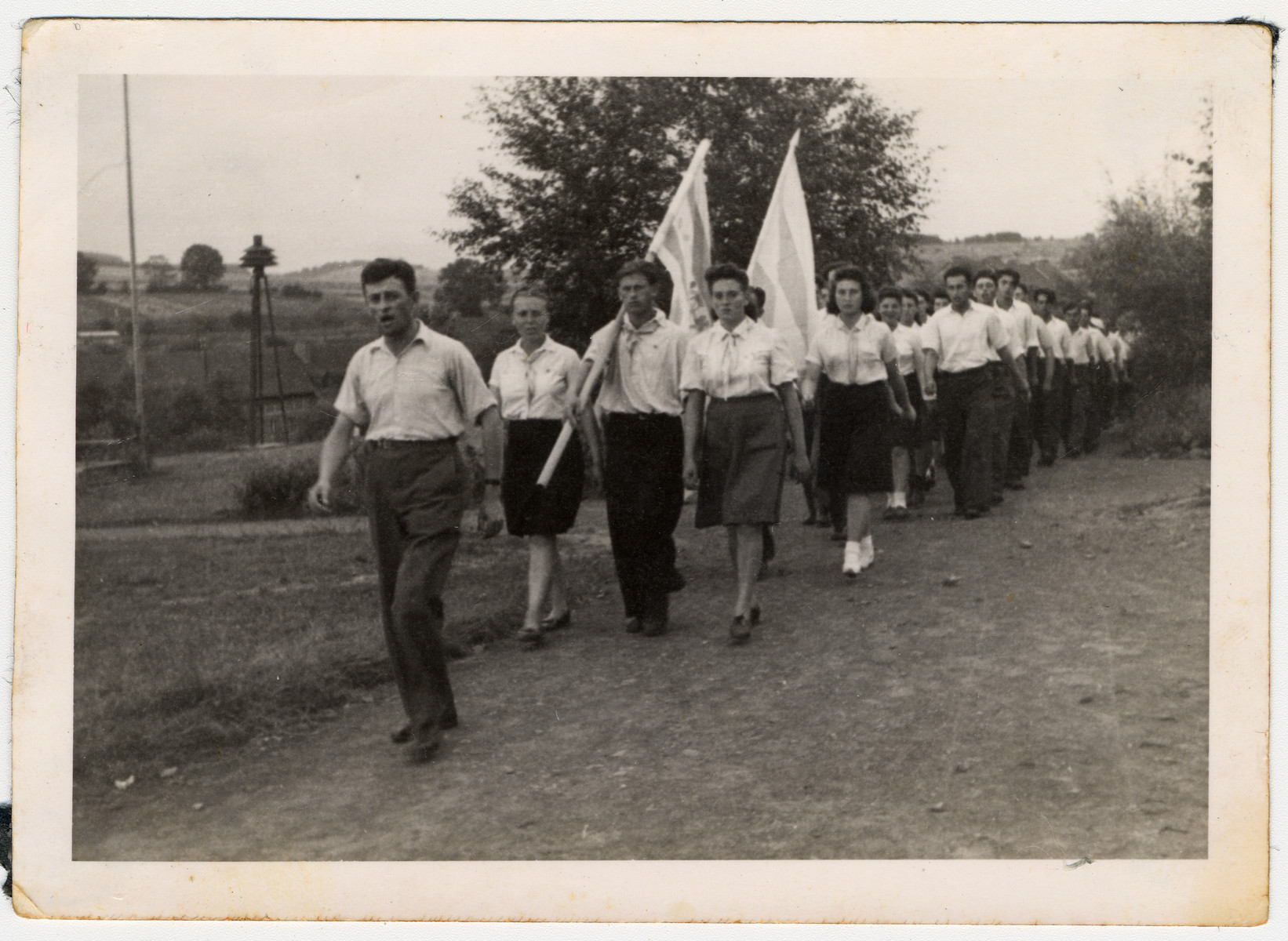 Jewish displaced person's march with a flag in a Zionist demonstration in Hessisch-Lichtenau.

Among those pictured is Sara Wiener.