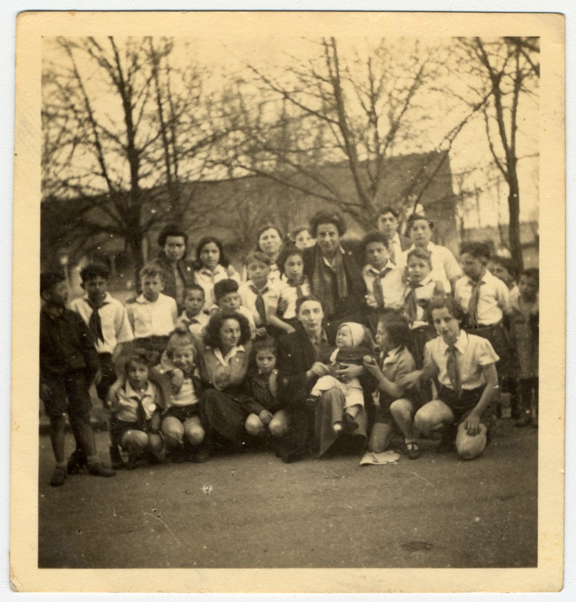 Group portrait of children in an orphanage in Israel.

Among those pictured is Sala Perec (front row, far right).