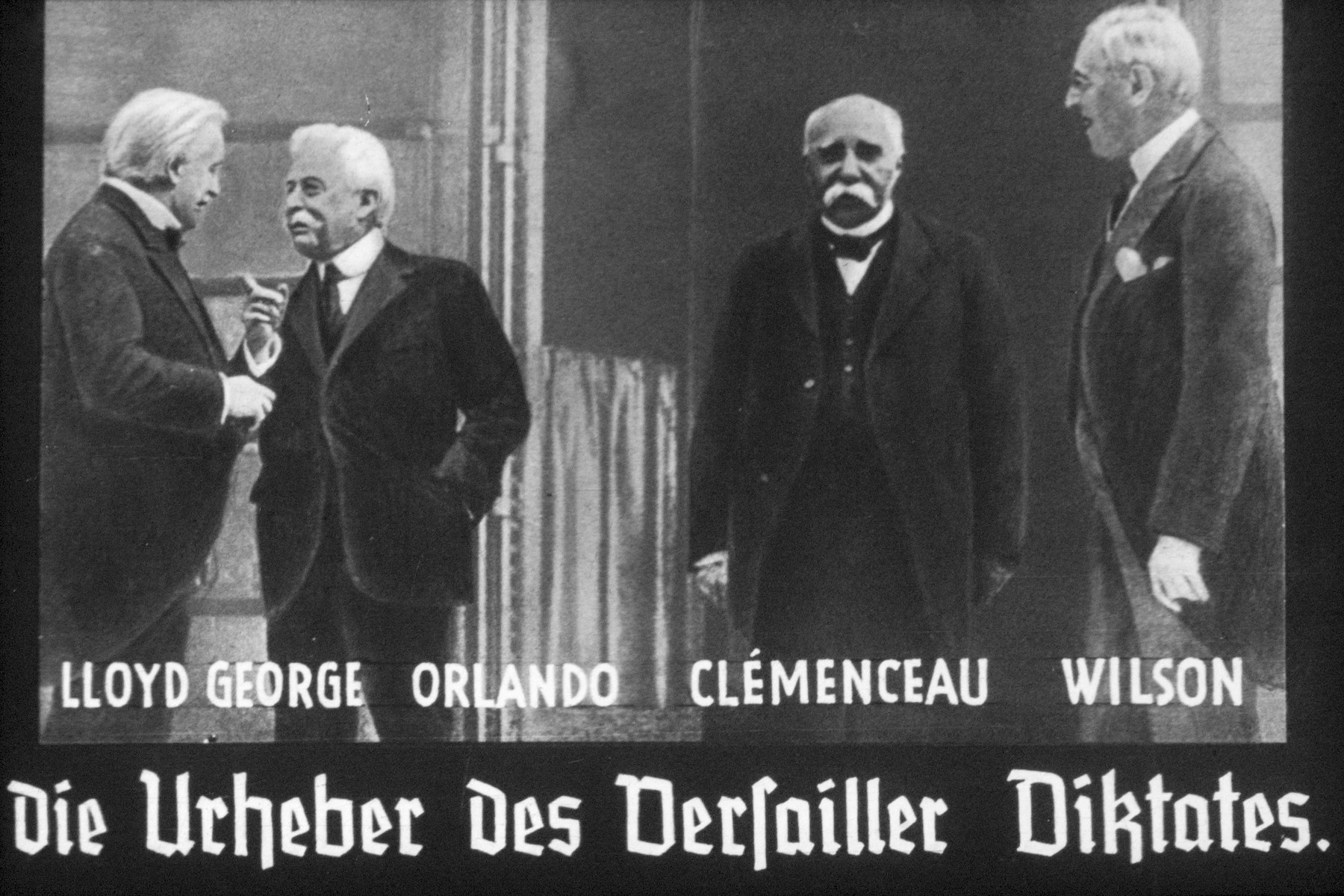 33th slide from a Hitler Youth slideshow about the aftermath of WWI, Versailles, how it was overcome and the rise of Nazism.

Lloyd George Orlando Cemenceau Wilson-Die Urheber des Versailler Diktates.
//
Lloyd George Orlando Cemenceau Wilson-The copyrighters) author of the Versailles Diktat.