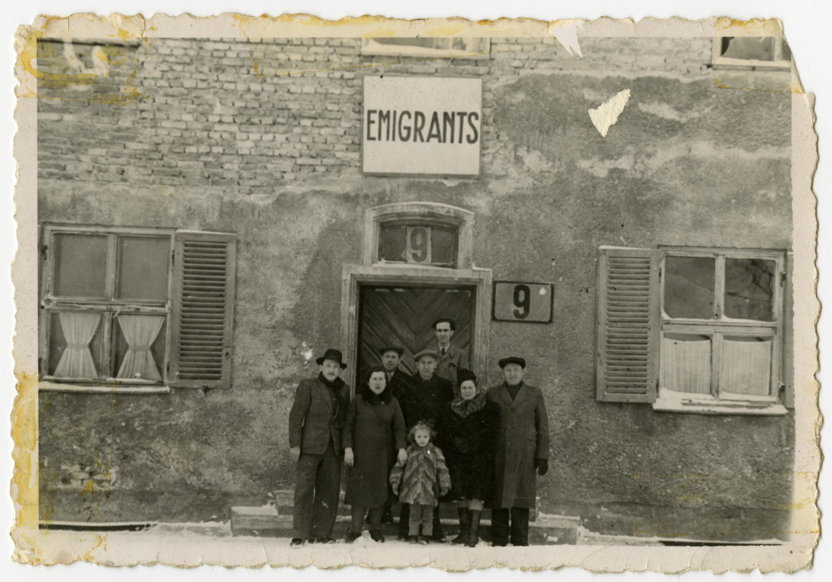 Jewish displaced persons pose in front of the emigration office in Bamberg.

From left to right in the front are Solomon, Ruchla and Frieda Zynstein.