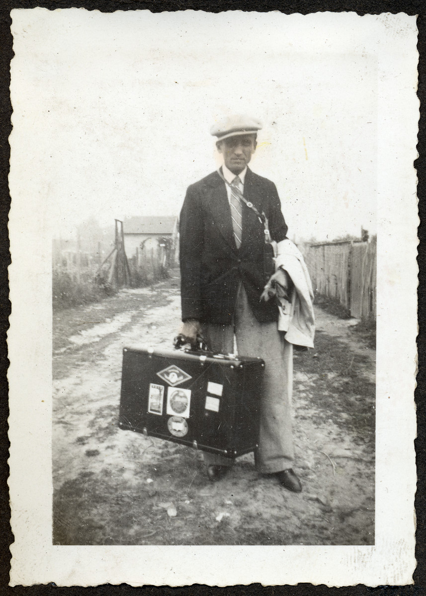 Portrait of a man [possibly Philip Roiter] carrying a suitcase down an unpaved road in an unidentified locale.

This is one photograph from the album of Rosalia Dratler Roiter.  She later was deported to and perished at Auschwitz.