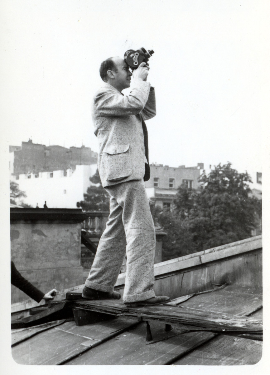 Julien Bryan films German planes on the roof of the American Consulate.

He writes in Siege: "Toward the end of the siege I was on the roof of the embassy....It was so exciting and thrilling that I quite forgot my fear. During the next half-hour I took three hundred feet of film as Nazi planes dove down within a few hundred yards of the embassy roof, seeming, through my view finder, to be almost upon me."